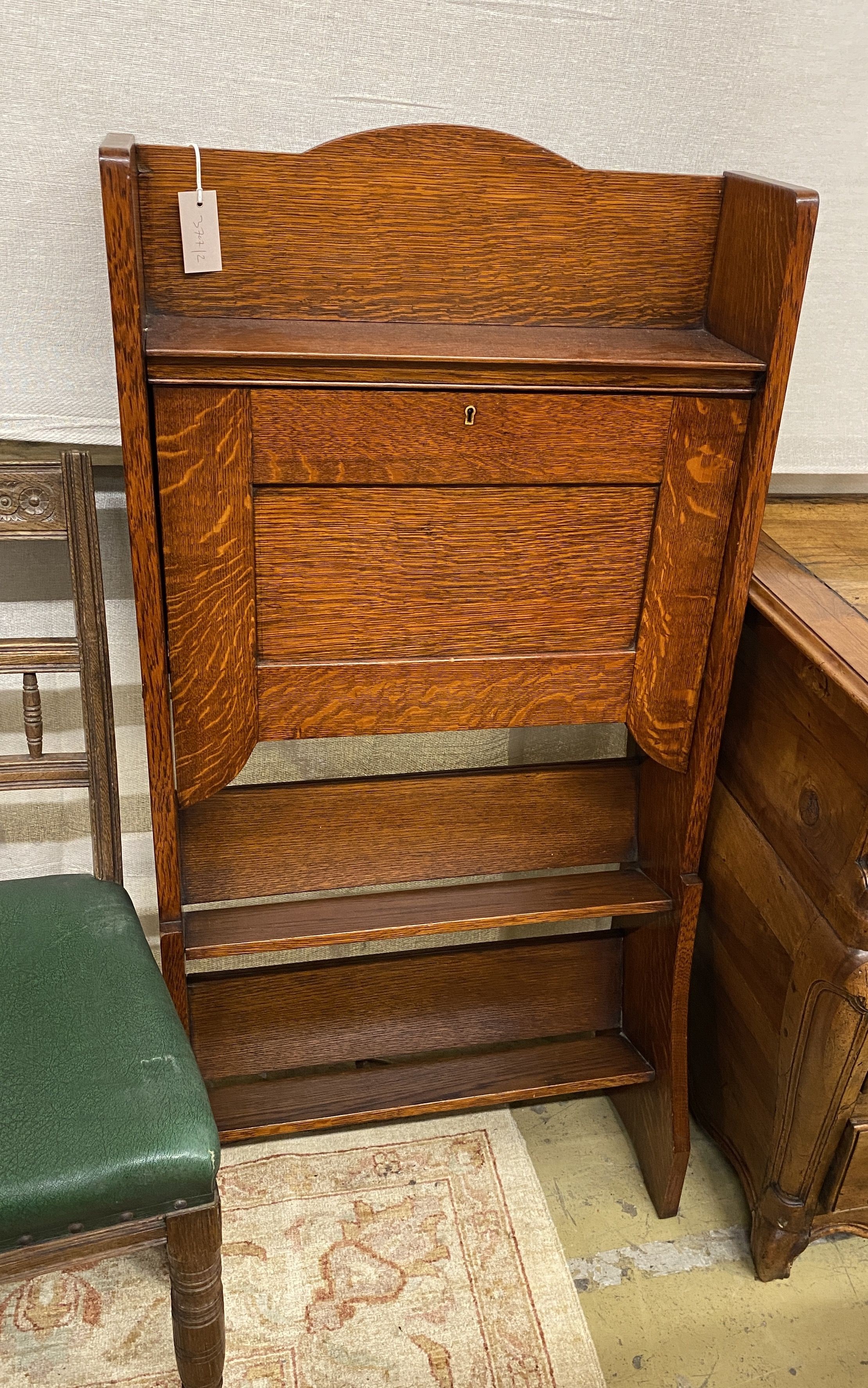 An early 20th century oak bureau, width 61cm, depth 17cm, height 122cm